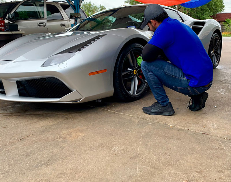 Wiping the Rims of a Luxury Car